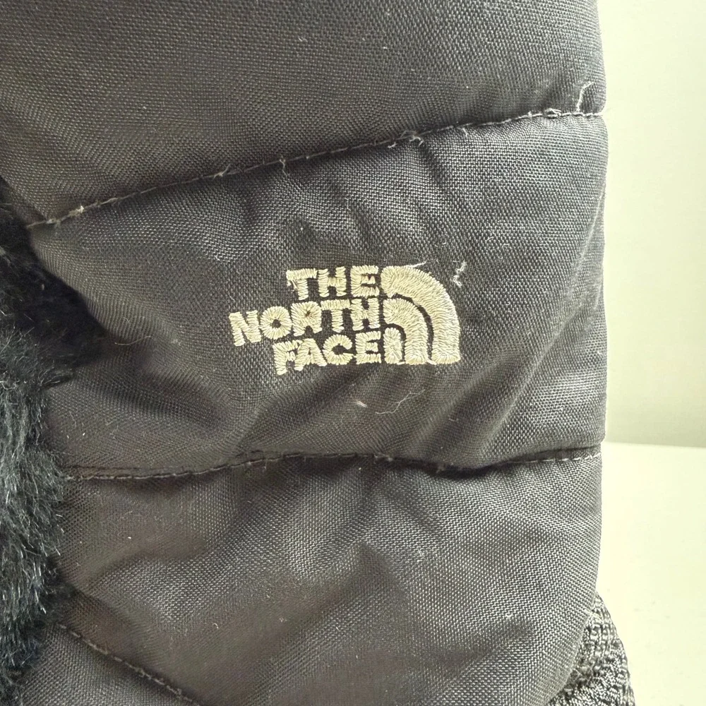 The North Face boots appears fur